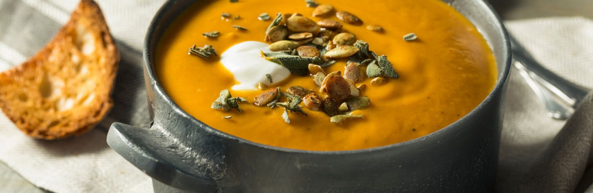 a cozy bowl of butternut squash soup, an example of winter soups